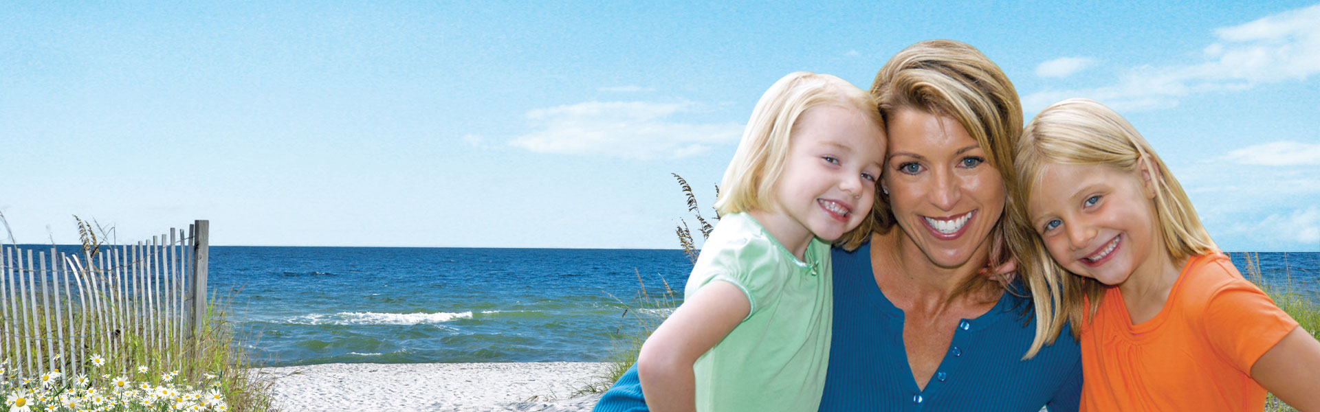 mother and daughters by the coast